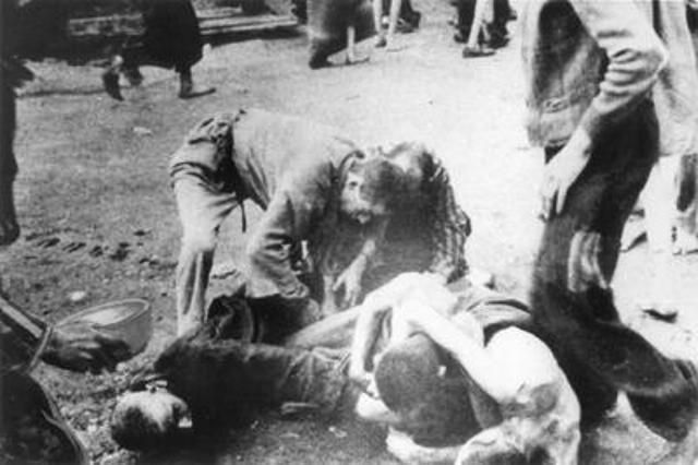 In the Mauthausen Krankenlager, the camp for the sick, hungry inmates fight for a slice of bread.